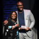 Whoopi Goldberg presents Tyler Perry the Impact Award at the Apollo Theater Spring Benefit.